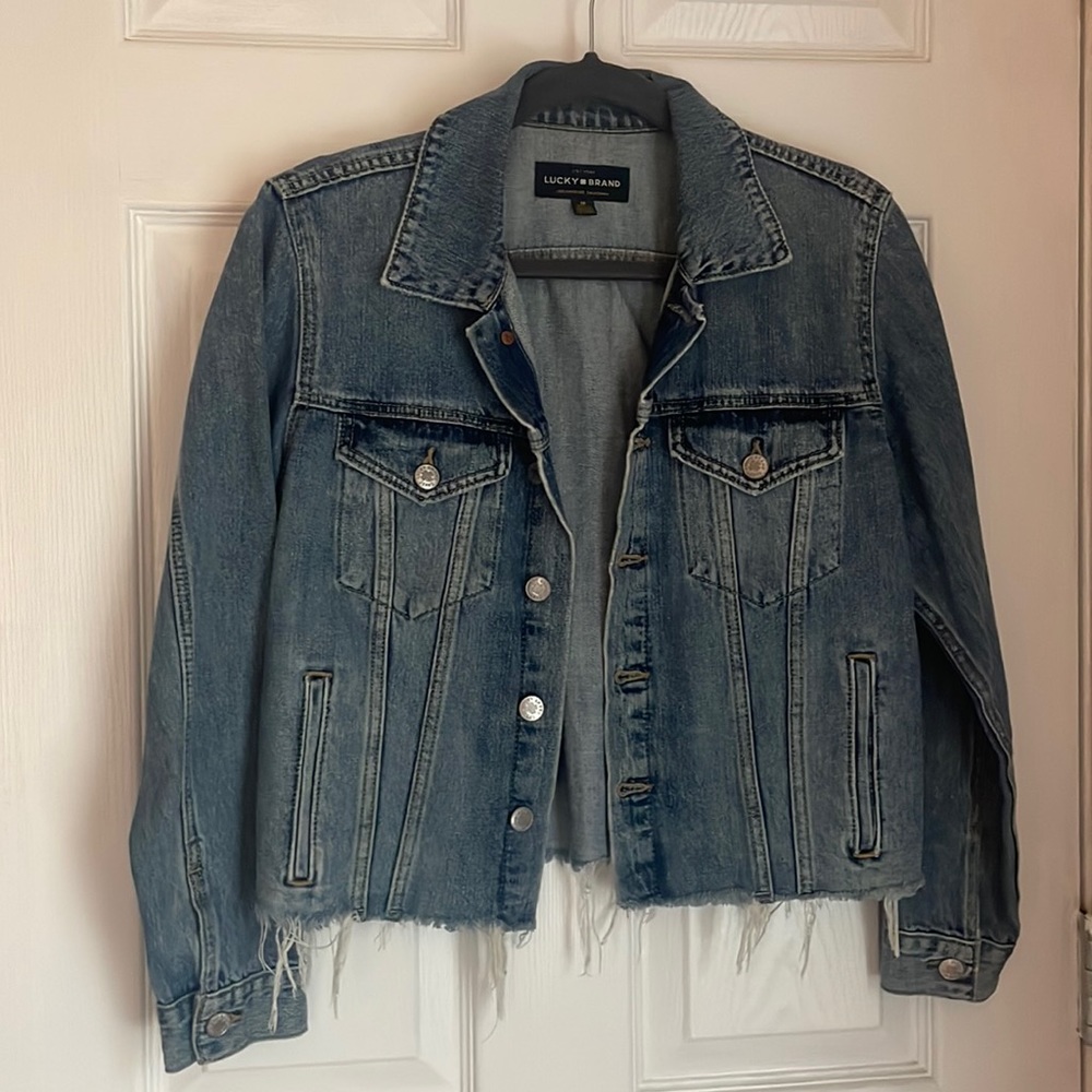 Never been worn lucky brand cropped Jean jacket, distressed at the bottom